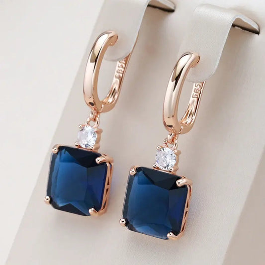 Oferta 1+1: Pendientes elegantes con cristal azul oscuro en oro