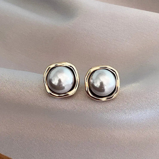 Oferta 1+1: Elegantes pendientes de perla negra.