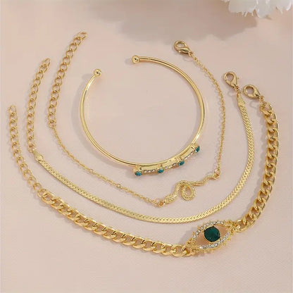 Gold emerald charm bracelet set