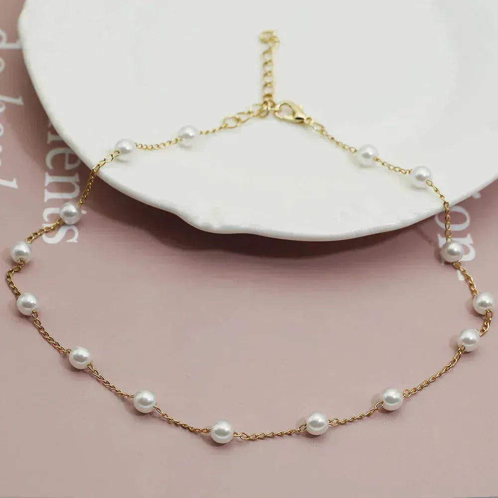 Gold spaced pearl chain necklace