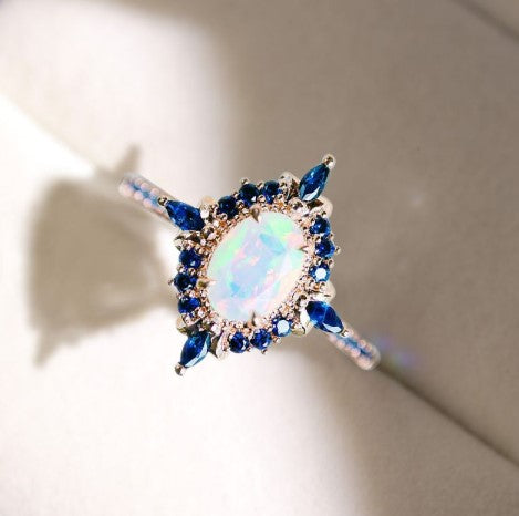 Rose Gold Halo Oval Cut Opal & Blue Sapphire Engagement Ring