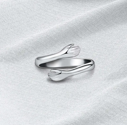 Anillo ajustable en forma de abrazo