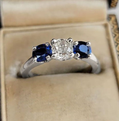 Three-Stone Cushion Cut White & Blue Sapphire Wedding Ring